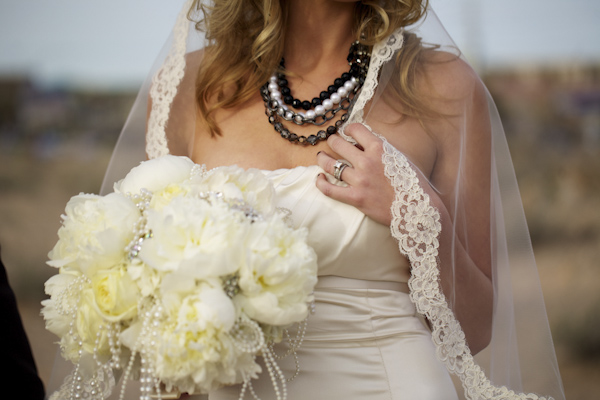 portrait of white bouquet - pearl and beaded necklace - wedding photo by top Orange County, California wedding photographers D. Park Photography
